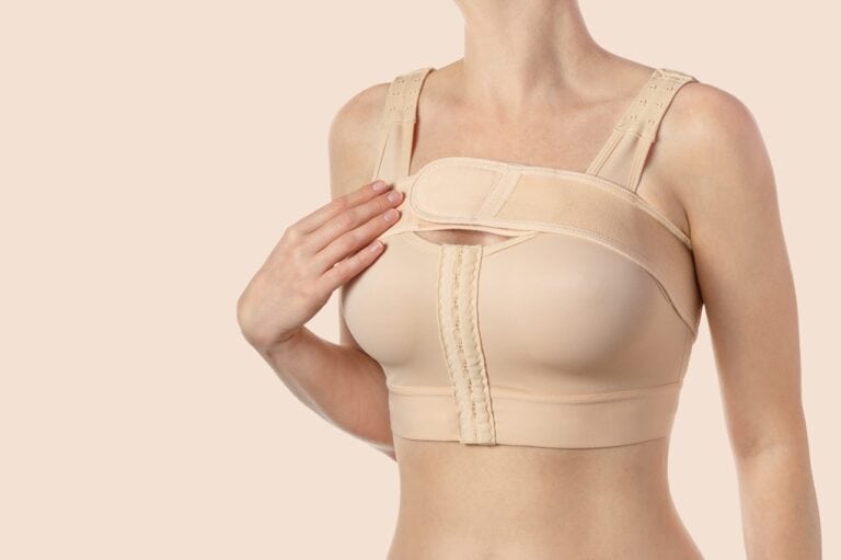 woman wearing compression bra after surgery