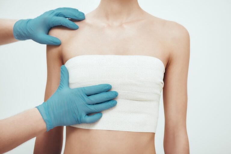 woman wearing compression garment after breast reduction