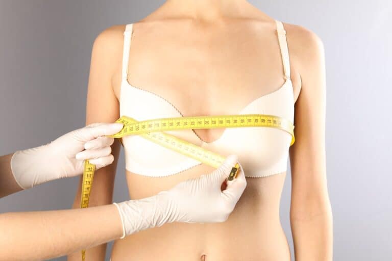 measuring woman's breast after reduction