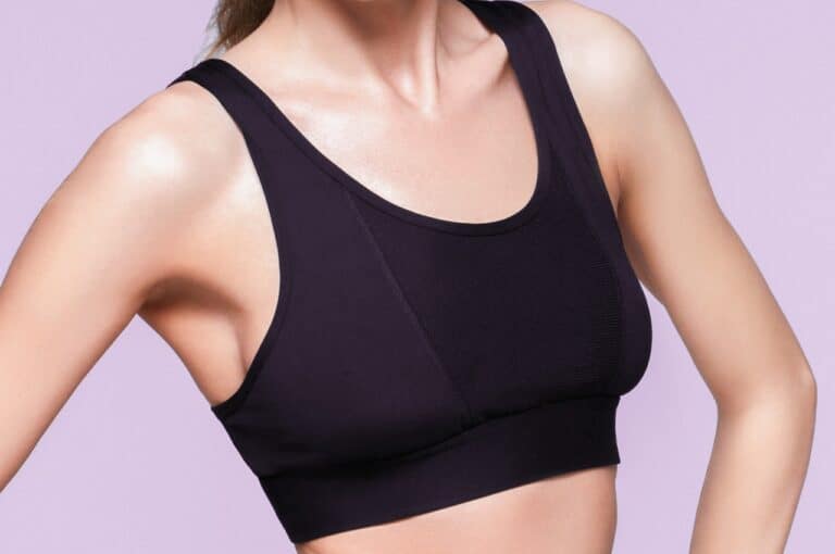 slim woman in sports bra