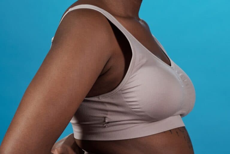 black woman in light colored compression bra