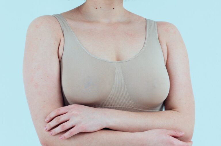 woman in nude colored sports bra